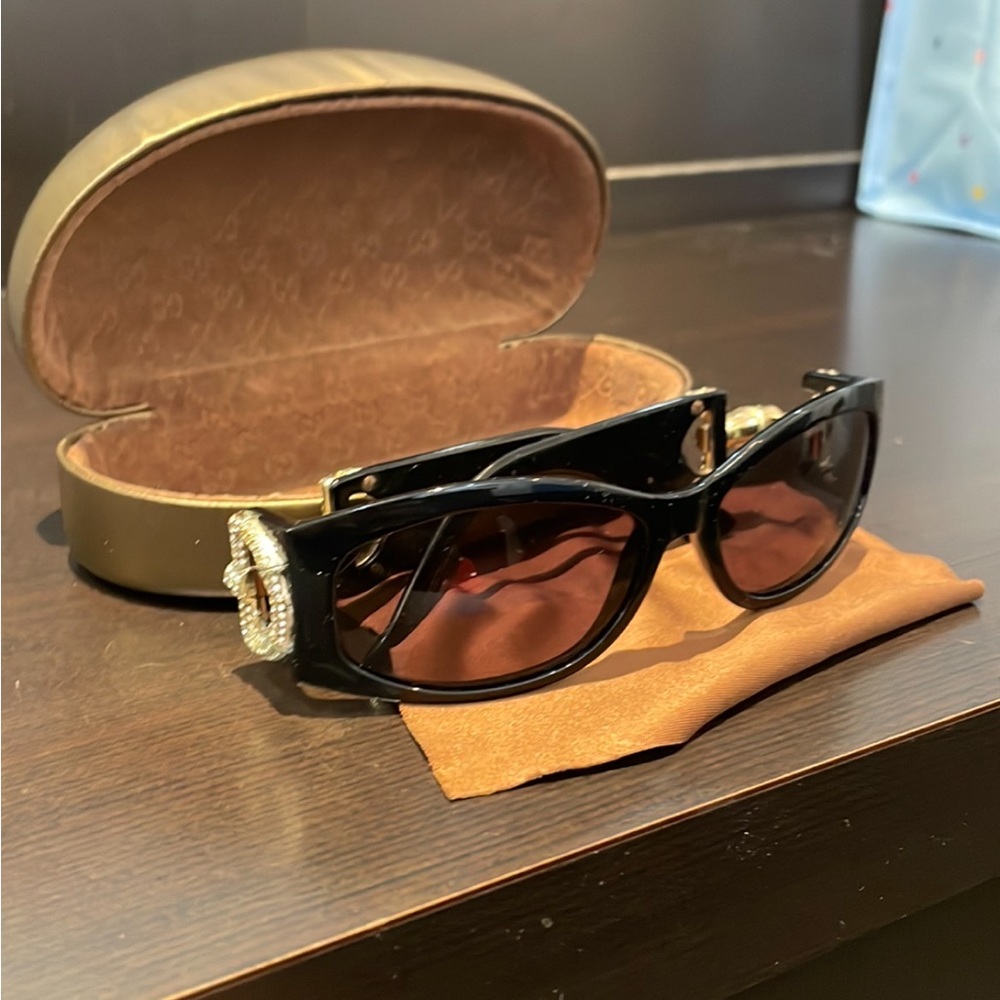 Gucci sunglasses in black.